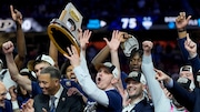 UConn head coach Dan Hurley celebrates with the trophy after their win against Purdue in the NCAA college Final Four championship basketball game, Monday, April 8, 2024, in Glendale, Ariz. (AP Photo/David J. Phillip)