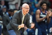 Connecticut head coach Dan Hurley celebrates in the second half of an NCAA college basketball game against Butler in Indianapolis, Saturday, Dec. 21, 2024. (AP Photo/Michael Conroy)
